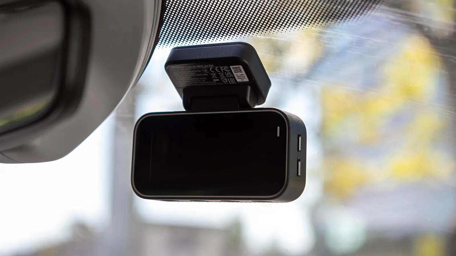 70mai A810 Lite dash camera mounted behind a vehicle's rearview mirror.